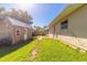 The house's backyard features a storage shed with a side door and sliding door at 44 Sunset Blvd, Ormond Beach, FL 32176