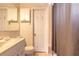 Classic bathroom with white fixtures, cabinet storage, and shower with curtain at 44 Sunset Blvd, Ormond Beach, FL 32176