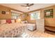 Inviting bedroom featuring two twin beds, tiled flooring, and ample natural light at 44 Sunset Blvd, Ormond Beach, FL 32176