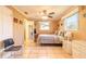 Cozy bedroom with a tiled floor, ceiling fan, and ample natural light at 44 Sunset Blvd, Ormond Beach, FL 32176