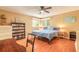 Bright bedroom with hardwood floors, ceiling fan, and well-lit bookcase at 44 Sunset Blvd, Ormond Beach, FL 32176