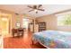 Comfortable bedroom featuring wood floors and a mirrored closet at 44 Sunset Blvd, Ormond Beach, FL 32176