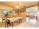 Open dining area with a decorative mirror wall leading into the living room space at 44 Sunset Blvd, Ormond Beach, FL 32176