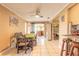 Comfortable dining room with adjacent kitchen area, tile floors, and natural light at 44 Sunset Blvd, Ormond Beach, FL 32176