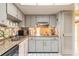 Bright kitchen with white cabinets, granite countertops, and stainless steel sink at 44 Sunset Blvd, Ormond Beach, FL 32176