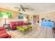 A bright living room featuring tile floors, ceiling fan and neutral wall paint at 44 Sunset Blvd, Ormond Beach, FL 32176