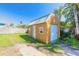 Exterior view of a well-maintained backyard storage shed with side door at 44 Sunset Blvd, Ormond Beach, FL 32176