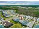 This aerial view shows the property in a vibrant community setting and close to various amenities and nature at 464 Tropics Ave, Daytona Beach, FL 32124