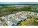 An aerial view showcasing the property within a well-maintained community, complemented by green spaces at 464 Tropics Ave, Daytona Beach, FL 32124