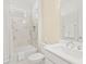 Neutral bathroom with marble tile shower, tub and single vanity at 464 Tropics Ave, Daytona Beach, FL 32124
