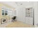 Multi-use room with a murphy bed, built-in shelving, and a desk at 464 Tropics Ave, Daytona Beach, FL 32124