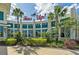 Exterior view of the fitness center featuring lush landscaping and a large Fins Up! sign at 464 Tropics Ave, Daytona Beach, FL 32124