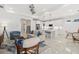 Open living room featuring marble floors, modern decor, and an adjacent kitchen and dining area at 464 Tropics Ave, Daytona Beach, FL 32124