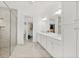 Modern main bathroom with double vanity, shower, and walk-in closet access at 464 Tropics Ave, Daytona Beach, FL 32124