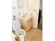 Functional bathroom with a toilet, vanity, and neutral tile flooring at 5076 Fairport Ave, De Leon Springs, FL 32130