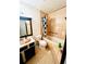 This bathroom features tile flooring, shower-tub combo, and an updated vanity at 5076 Fairport Ave, De Leon Springs, FL 32130