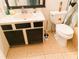 Bathroom featuring tile floors, updated vanity, toilet, and natural light at 5076 Fairport Ave, De Leon Springs, FL 32130