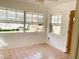 Well-lit bedroom with large windows and tile flooring, offering a bright and airy feel at 5076 Fairport Ave, De Leon Springs, FL 32130