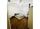 Bedroom features wood floors, a ceiling fan, natural light, and a neutral color palette at 5076 Fairport Ave, De Leon Springs, FL 32130