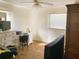 Comfortable bedroom with natural light, wood floors, and ample space for a bed and storage at 5076 Fairport Ave, De Leon Springs, FL 32130