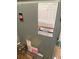 Close-up of the furnace showing warning and information labels at 5076 Fairport Ave, De Leon Springs, FL 32130