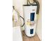 A water heater is installed next to a washing machine in this utility room at 5076 Fairport Ave, De Leon Springs, FL 32130