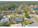 Beautiful aerial view of the home and neighborhood, featuring lush landscaping and a lovely lake at 6 Greenvale Dr, Ormond Beach, FL 32174