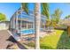 This home has a spacious backyard with a patio, screened-in pool, and lovely landscaping, perfect for relaxing at 6 Greenvale Dr, Ormond Beach, FL 32174