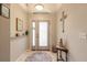 Inviting foyer with a decorative rug and charming decor, creating a warm welcome at 6 Greenvale Dr, Ormond Beach, FL 32174