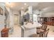 Well-lit kitchen with gray cabinetry, a breakfast bar, and tiled floors, perfect for modern living at 6 Greenvale Dr, Ormond Beach, FL 32174