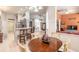 Bright, open kitchen with white cabinets and a lovely breakfast nook for casual dining at 6 Greenvale Dr, Ormond Beach, FL 32174