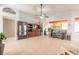Spacious living area with tile flooring, large shelving, and access to other rooms at 6 Greenvale Dr, Ormond Beach, FL 32174