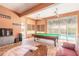 Open living room featuring a pool table, perfect for entertaining and relaxing at 6 Greenvale Dr, Ormond Beach, FL 32174