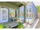 The patio provides access to the screened in pool and offers a bench to sit and enjoy the lovely landscaping at 6 Greenvale Dr, Ormond Beach, FL 32174