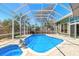 A gorgeous in-ground pool and spa are the focal point of the home's backyard and the beautiful screen enclosure at 6 Greenvale Dr, Ormond Beach, FL 32174