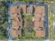 Overhead view of a well-maintained townhome community with landscaped green spaces at 60 N Halifax Dr # 1050, Ormond Beach, FL 32176
