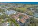 Scenic aerial view featuring homes near a golf course and the beautiful coastline at 60 N Halifax Dr # 1050, Ormond Beach, FL 32176