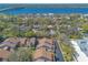 Aerial view of townhomes surrounded by lush greenery, and waterfront scenery at 60 N Halifax Dr # 1050, Ormond Beach, FL 32176