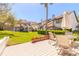 Charming backyard with outdoor seating, green lawn, and a manicured garden for relaxed outdoor living at 60 N Halifax Dr # 1050, Ormond Beach, FL 32176