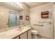 Clean bathroom featuring a sink, toilet, and accessible shower, offering convenience and style at 60 N Halifax Dr # 1050, Ormond Beach, FL 32176