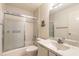 Bright bathroom with a shower and tub combo, mirrored vanity, and neutral tile at 60 N Halifax Dr # 1050, Ormond Beach, FL 32176