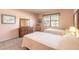 Bright bedroom featuring two beds, dresser, and a window, creating a comfortable and inviting space at 60 N Halifax Dr # 1050, Ormond Beach, FL 32176