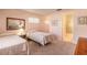 Cozy bedroom featuring two twin beds and soft, neutral tones for a relaxing atmosphere at 60 N Halifax Dr # 1050, Ormond Beach, FL 32176