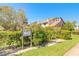 Inviting condo exterior with lush landscaping and a clear building number sign at 60 N Halifax Dr # 1050, Ormond Beach, FL 32176