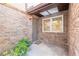 Charming brick entryway with a cozy welcome mat and ample natural light at 60 N Halifax Dr # 1050, Ormond Beach, FL 32176