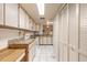 Efficient kitchen featuring a range, microwave, ample cabinets, and stone countertops at 60 N Halifax Dr # 1050, Ormond Beach, FL 32176