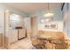 Bright laundry area with white appliances, tile flooring, and a charming breakfast nook for relaxed mornings at 60 N Halifax Dr # 1050, Ormond Beach, FL 32176