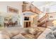 Inviting living room with a staircase, open to dining area, and filled with natural light at 60 N Halifax Dr # 1050, Ormond Beach, FL 32176