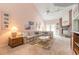 Spacious living room featuring a fireplace, vaulted ceilings and lots of natural light at 60 N Halifax Dr # 1050, Ormond Beach, FL 32176