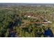 An aerial view shows the layout and boundary of this vast parcel of heavily wooded land at 600 Tabatha Dr, Osteen, FL 32764